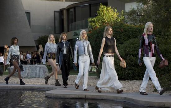 Models present designs from Louis Vuitton's women CRUISE 2016 collection during a fashion show at the estate of entertainer Bob Hope in Palm Springs