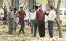People rush out of their offices after earthquake jolts Patna on May 12, 2015.