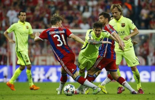 Barcelona's Lionel Messi and Ivan Rakitic in action with Bayern Munich's Bastian Schweinsteiger and Xabi Alonso