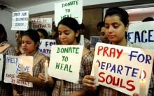 Students participate in a candlelight vigil to pay tribute to Nepal earthquake victims in Amritsar, on May 13, 2015.