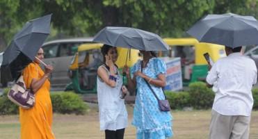 New delhi,rain in new delhi,new delhi rains,rain photos,delhi rain photos