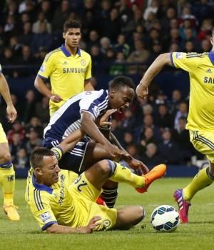 ohn Terry fouls West Brom's Saido Berahino resulting in a penalty Action