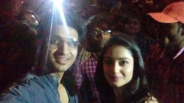 Nikhil Siddhartha and Tridha Choudhary pose for a selfie with fans at Rajdhani Theatre in Hyderabad