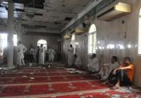 Family members of victims and well wishers are seen after a suicide bomb attack at the Imam Ali mosque