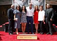 Dwayne 'The Rock' Johnson poses with his family during his hand and footprints ceremony