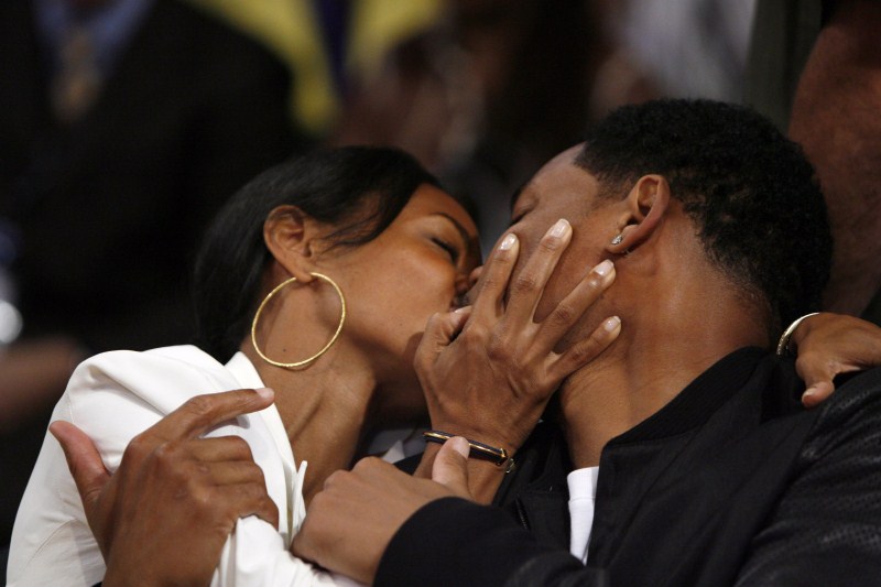 Jada Pinkett-Smith (L) kisses her husband Will Smith as the Los Angeles Lakers play the Boston Celtics in Game 4 of the NBA Finals basketball championship in Los Angeles When the Stars Kiss,Stars Kiss,celebrities lock lips,lock lips,celebs lock lips,kiss the stars with me,kiss the stars horse,kiss the stars chords,Kiss the Stars,lip lock,hot kiss,hot kiss pics,hot kiss images,hot kiss stills
