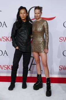 Designer Alexander Wang and model Anna Ewers arrives for the 2015 CFDA Fashion Awards