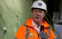 Britain's Prime Minister David Cameron speaks during a visit to the construction site of the Crossrail Farringdon station in London