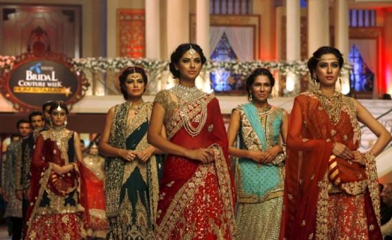 Models present creations by Pakistani designer Hassan Sheheryar Yasin (HSY) during Bridal Couture Week in Karachi