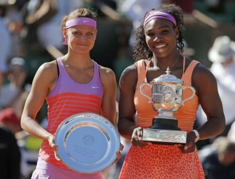Serena Williams of the U.S. (R) poses with Lucie Safarova of the Czech Republic during the trophy ceremony after she won their women's singles final match during the French Open tennis