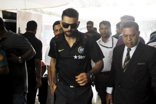 Captain of the Indian cricket team Virat Kohli enters a hotel after the team arrived in Bangladesh's capital Dhaka
