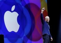 Apple CEO Tim Cook waves as he arrives on stage to deliver his keynote address at the Worldwide Developers Conference in San Francisco