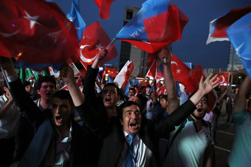 Supporters wave Turkish flags and shout slogans outside the AK Party headquarters in Ankara, Turkey Faces a New Political Reality,Turkey New Political Reality,New Political Reality,Tayyip Erdogan,AK Party,Erdogan,Supporters of Turkey's,Turkey,Prime Minister Ahmet Davutoglu,Ahmet Davutoglu