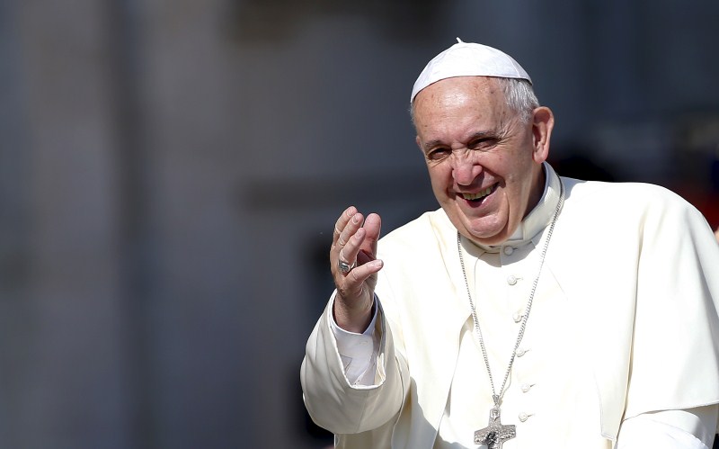 Pope Francis waves as he arrives Saint Peter's square at the Vatican ...