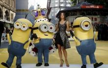 Actress Sandra Bullock poses with characters in costume from the film during the 'Minions' World Premiere at Leicester Square in London