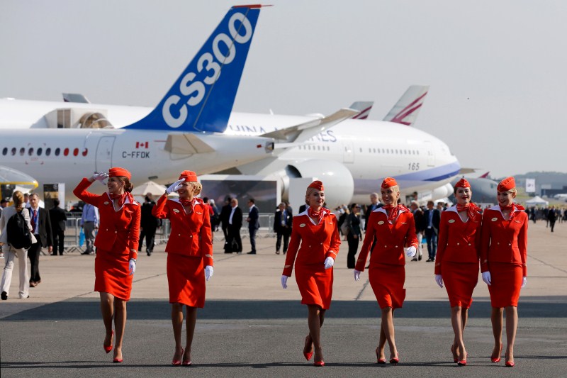 Cabin crew members of Russian carrier Aeroflot walk past aircrafts 51st Paris Air Show,51st Paris Air Show at Le Bourget Airport,Le Bourget Airport,Air Show,51st International Paris Air Show,51st Paris Air Show 2015,Air Show 2015,Air Show pics,Paris International Air Show 2015,Paris air show