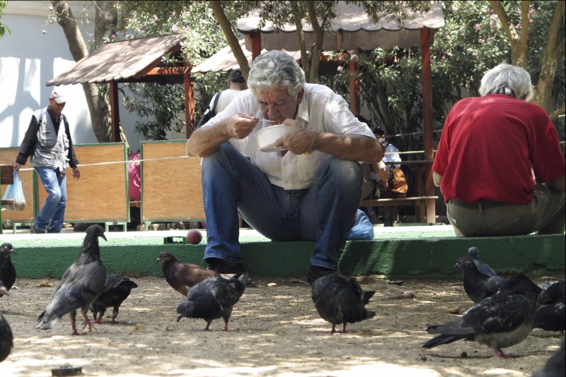 A man eats his meal at a soup kitchen for the poor in central Athens Greece's Pension Problem,Greece Pension Problem,Pension Problem,Greek Pension System,European Pensions,Greece's generous pensions,Greece's Pension System
