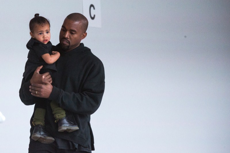 Kanye West carries his daughter Fathers' Day,Fathers' Day 2015,Hollywood celebs with their Kids,celebs with their Kids,Happy Father's Day,dads and their kids,celebrities with their kids,celebrity kids