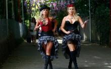Polish pop star Pola Pospieszalska (L) and model Victoria Eisermann pose outside Ascot race course on Ladies Day