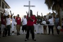 People pray outside Emanuel African Methodist Episcopal Church in Charleston