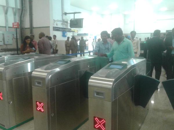 Commuters swiping travel cards to enter station Chennai Metro,Jayalalithaa to launch Chennai Metro,Chennai Metro pics,Chennai Metro launch,chennai metro rail,Jayalalithaa,Chief Minister J Jayalalithaa,Chennai Metro started from today,Chennai metro to be lauched today,Jayalalithaa launches Chennai Metro