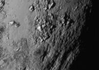 A new close-up image of a region near Pluto's equator reveals a range of youthful mountains rising as high as 11,000 feet (3,500 meters) above the surface