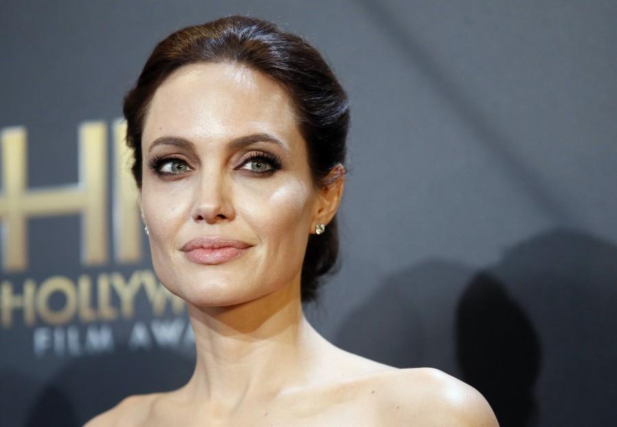 Angelina Jolie poses backstage at the Hollywood Film Awards in Hollywood, California. Angelia jolie,angelia jolie photos,angelia jolie special moments,angelia jolie upcoming films