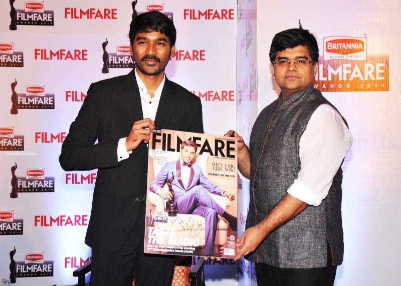 Dhanush and Jitesh Pillaai (Editor, Filmfare Magazine) at the '62nd Britannia Filmfare South Awards' special issue launch at The Leela Palace. Dhanush,Dhanush on the cover of special edition of Filmfare South,Dhanush and Jitesh Pillaai,Jitesh Pillaai,Filmfare South,Dhanush unveils the Filmfare cover,Dhanush on Filmfare cover,Filmfare cover page,Dhanush latest pics,Dhanush latest images,Dhanush l