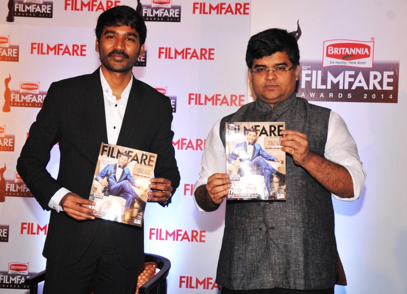 Dhanush and Jitesh Pillaai (Editor, Filmfare Magazine) at the '62nd Britannia Filmfare South Awards' special issue launch at The Leela Palace. Dhanush,Dhanush on the cover of special edition of Filmfare South,Dhanush and Jitesh Pillaai,Jitesh Pillaai,Filmfare South,Dhanush unveils the Filmfare cover,Dhanush on Filmfare cover,Filmfare cover page,Dhanush latest pics,Dhanush latest images,Dhanush l