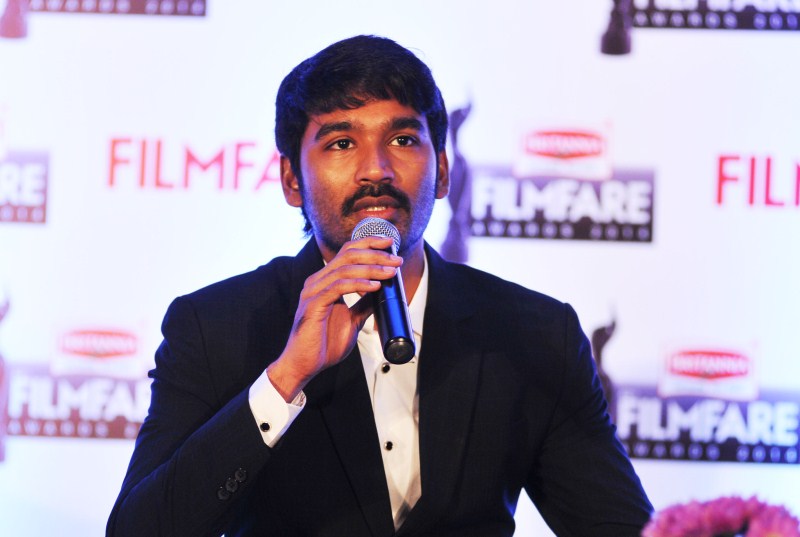 Dhanush and Jitesh Pillaai (Editor, Filmfare Magazine) at the '62nd Britannia Filmfare South Awards' special issue launch at The Leela Palace. Dhanush,Dhanush on the cover of special edition of Filmfare South,Dhanush and Jitesh Pillaai,Jitesh Pillaai,Filmfare South,Dhanush unveils the Filmfare cover,Dhanush on Filmfare cover,Filmfare cover page,Dhanush latest pics,Dhanush latest images,Dhanush l