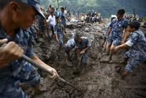 Landslides triggered by torrential rain in Nepal swept through villages on Thursday, killing at least 30 people close to the nationâ€™s most popular trekking circuit.