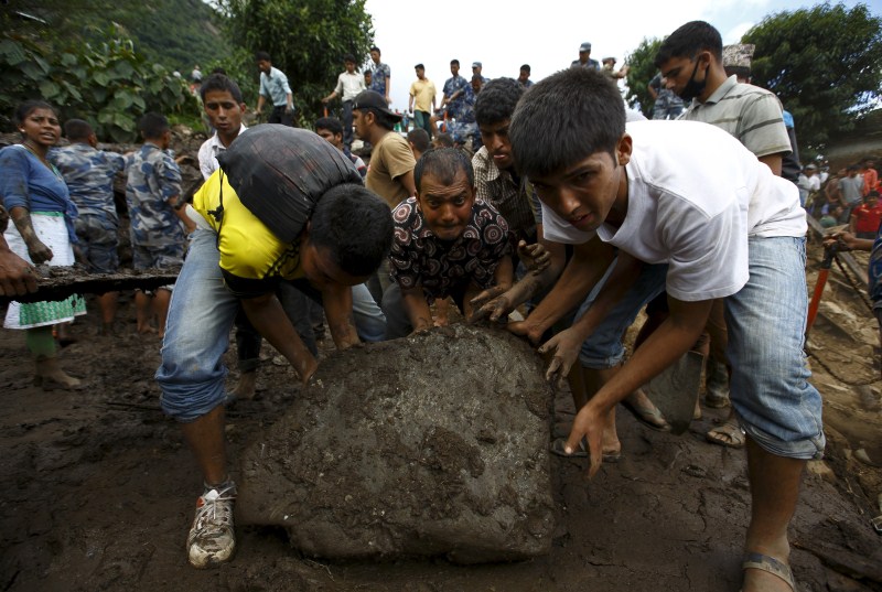 Landslides triggered by torrential rain in Nepal swept through villages on Thursday, killing at least 30 people close to the nation’s most popular trekking circuit. Nepal Landslides triggered by Rain,Landslides in Nepal,Landslides,Kaski district,Nepal,Landslides bury Nepal villages,Landslides in Western Nepal,heavy rain,heavy rain in Nepal