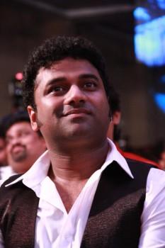 Photos of Devi Sri Prasad at Vijay's Puli Audio Launch.