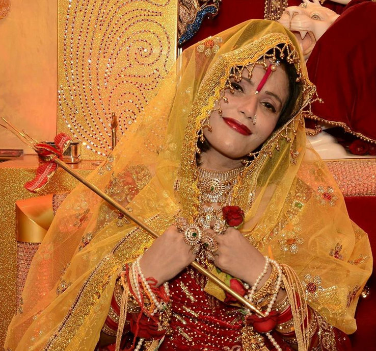 Self-styled godwoman from Punjab Radhe Maa is being sued for obscenity. Her photos wearing short pink dress has gone viral. Radhe Maa,Radhe Maa photo,Hot radhe maa photos,Radhe maa in dress photos,Indian godwoman,godwoman,Radhe maa pictures,Radhe maa criminal case,goddess