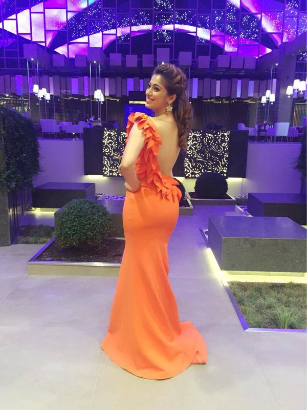 Check out photos of Raai Laxmi attending SIIMA Awards 2015 in Dubai. Siima awards 2015,raai laxmi,rai lakshmi,lakshmi rai in dubai,raai laxmi siima dress,raai laxmi siima orange gown