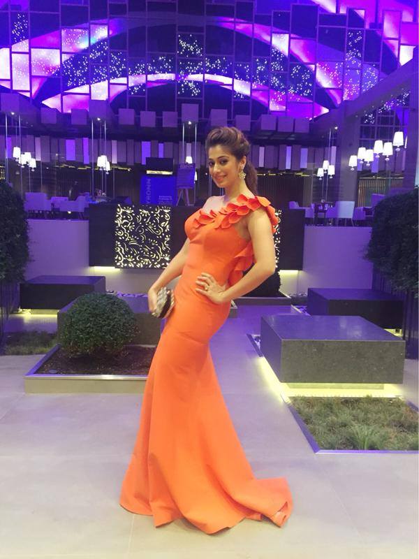 Check out photos of Raai Laxmi attending SIIMA Awards 2015 in Dubai. Siima awards 2015,raai laxmi,rai lakshmi,lakshmi rai in dubai,raai laxmi siima dress,raai laxmi siima orange gown
