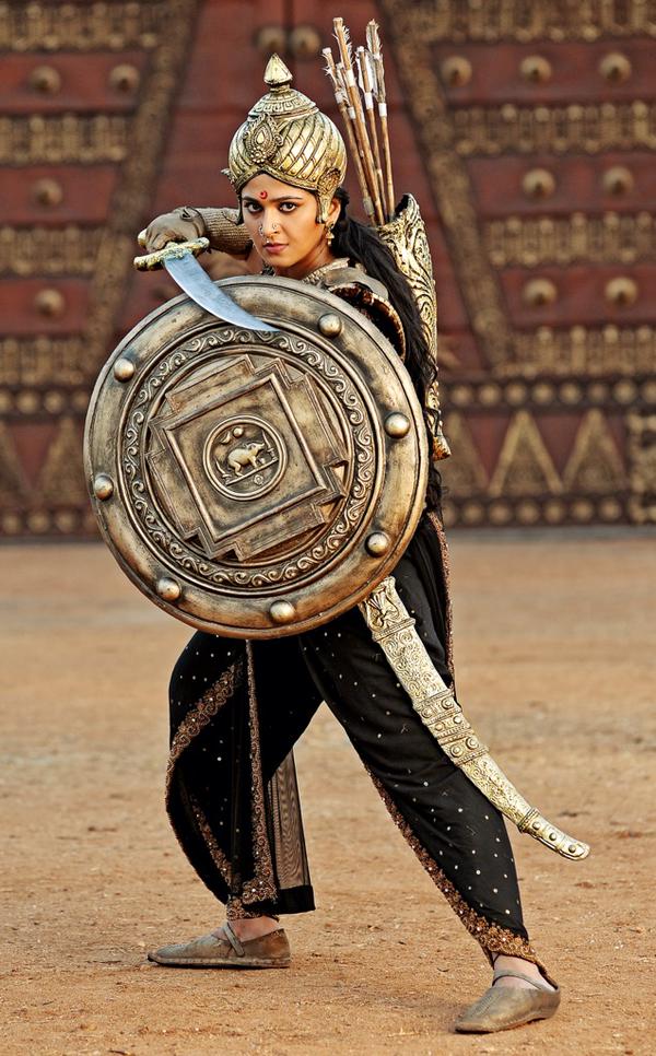 Rudhramadevi is an upcoming Telugu historical film, directed by Gunasekhar in 3D. The film is being dubbed into Tamil and Malayalam and has Anushka Shetty, Allu Arjun, Rana Daggubati, Vikramjeet Virk, Prakash Raj, Krishnam Raju, Nithya Menon, Baba Sehgal and Catherine Tresa. Rudhramadevi,Rudhramadevi Movie Poster,Rudhramadevi Poster,Anushka Shetty,Rana Daggubati,Allu Arjun,Nithya Menon,Rudhramadevi movie stills,Rudhramadevi movie pics,Rudhramadevi movie images,Rudhramadevi movie photos,Rudhramadevi movie pictures