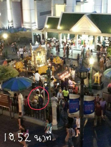 Thai police have release the image of the man behind the Bangkok bomb blast. The man, wearing yellow shirt and black rimmed-glasses, is seen placing bag at Erawan Shrine containing the bomb. Bangkok blast bomber,bangkok blast,photos,bangkok blast bomber pictures,bangkok bomber,blast,Erawan Shrine bomb blast,Erawan Shrine,Thailand bomb blast,bomb blast