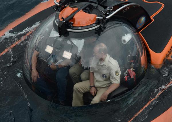 Russian President Vladimir Putin is seen inside a research bathyscaphe while submerging into the waters of the Black Sea as he takes part in an expedition near Sevastopol, Crimea. Vladimir Putin,Vladimir Putin photos,Vladimir Putin news,putin bathyscaphe,Vladimir Putin under water