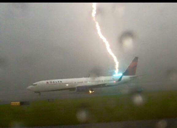 Photos of Lightning strikes Delta plane on Atlanta runway. Lightning strikes Delta plane,Lightning,Lightning Strikes Plane,Caught on Camera,Airlines plane hit by lightning bolt