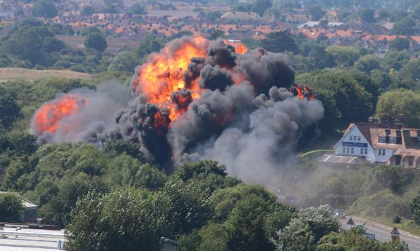 A military jet taking part in the Shoreham Air Show crashed into a busy main road on Saturday, killing 11 people and injuring more than a dozen others.The Hawker Hunter fighter jet crashed near Brighton after the pilot failed to pull out of a loop manoeuvre. Videos and photos of the deadly accident shared on social media shows, the Hawker Hunter fighter jet going in up in the sky, before plummeting speedily into the busy road. A huge fireball is seen erupting through the tress amid plumes of black smoke folowing the crash. Shoreham Air Show plane crash,military jet crashes at air show,airshow,Hawker Hunter fighter jet,images of shoreham airshow crash,British airshow,crash,plane crash,airshow plane crashes