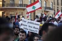 Thousands of protesters waving Lebanese flags and chanting 