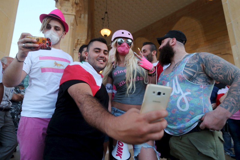 Thousands of protesters waving Lebanese flags and chanting Lebanon protests in Beirut,Lebanon,anti-government protests in Beirut,protests in Beirut,Beirut,Lebanese,protests,Lebanese national flags,Lebanese Pop star Myriam Klink,Pop star Myriam Klink,Myriam Klink