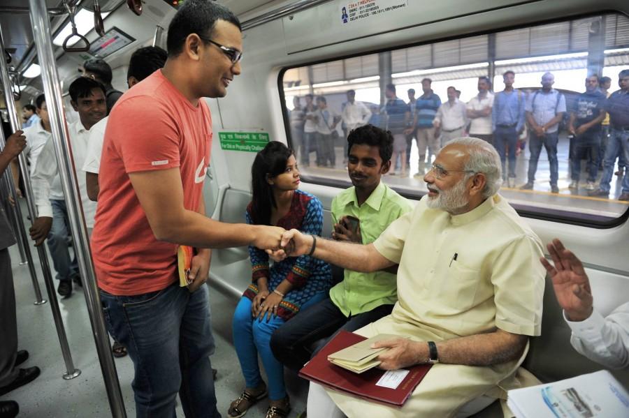 Indian Prime Minister Narendra Modi traveled in Metro train from New Delhi to Faridabad on Sunday, 6 September. Narendra modi,modi in metro,metro train,narendra modi in metro train