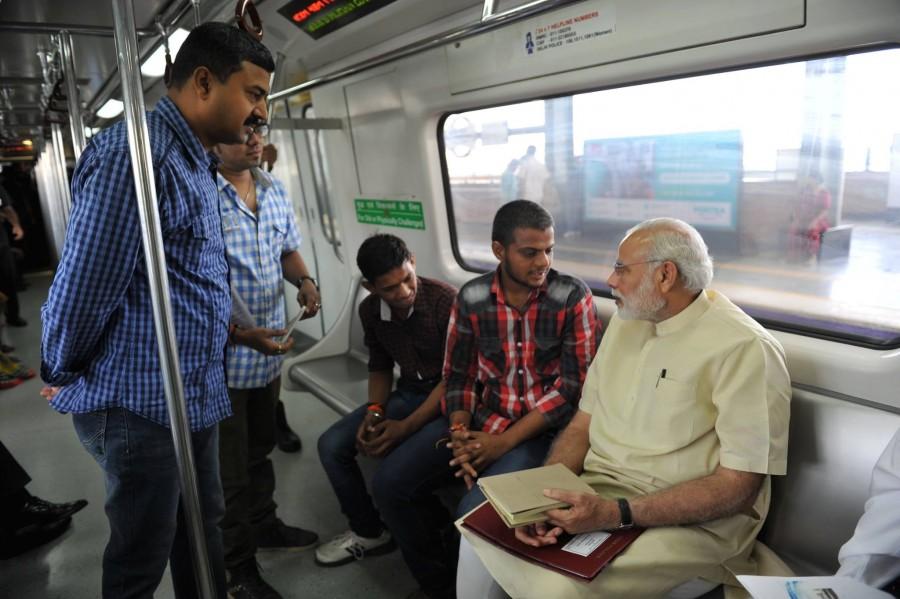 Indian Prime Minister Narendra Modi traveled in Metro train from New Delhi to Faridabad on Sunday, 6 September. Narendra modi,modi in metro,metro train,narendra modi in metro train