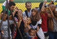 Hundreds of migrants, including Syrian refugees, were stranded on a 