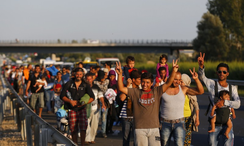 Migrants march along the highway towards the border with Austria, out of Budapest, Hungary. Hundreds of migrants,Budapest,Austria,The long march to Austria,Migrants,refugees