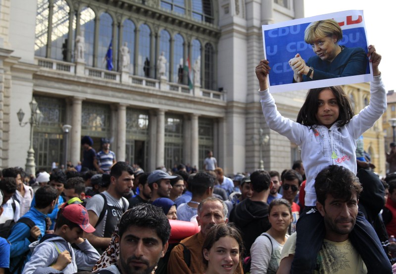 Migrants march along the highway towards the border with Austria, out of Budapest, Hungary. Hundreds of migrants,Budapest,Austria,The long march to Austria,Migrants,refugees