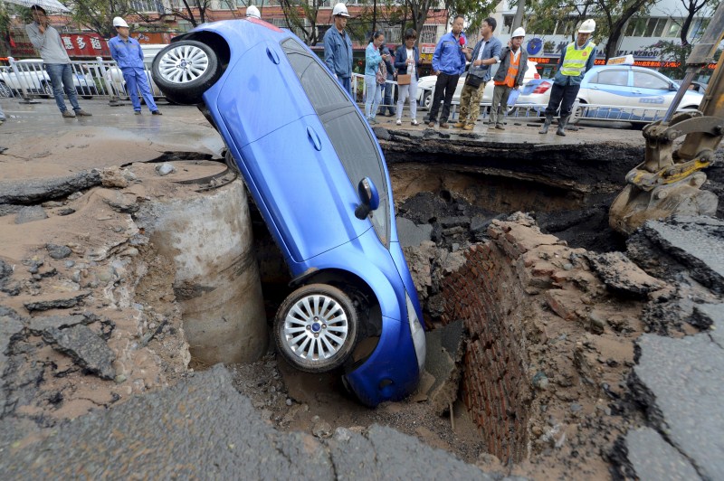 Sinkholes can be deadly - swallowing residents and damaging infrastructure. Sinkholes,Giant Sinkholes,deadly Sinkholes,Sinkholes Around the World,biggest Sinkholes