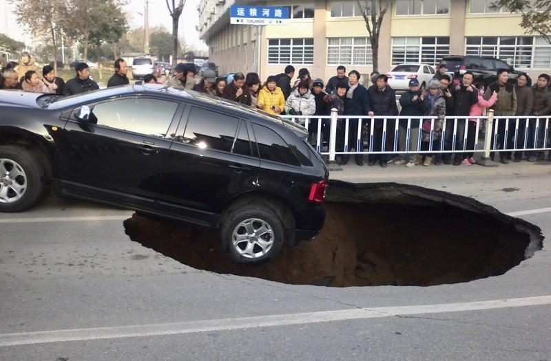 Sinkholes can be deadly - swallowing residents and damaging infrastructure. Sinkholes,Giant Sinkholes,deadly Sinkholes,Sinkholes Around the World,biggest Sinkholes